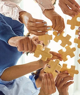 Members working together to solve a puzzle